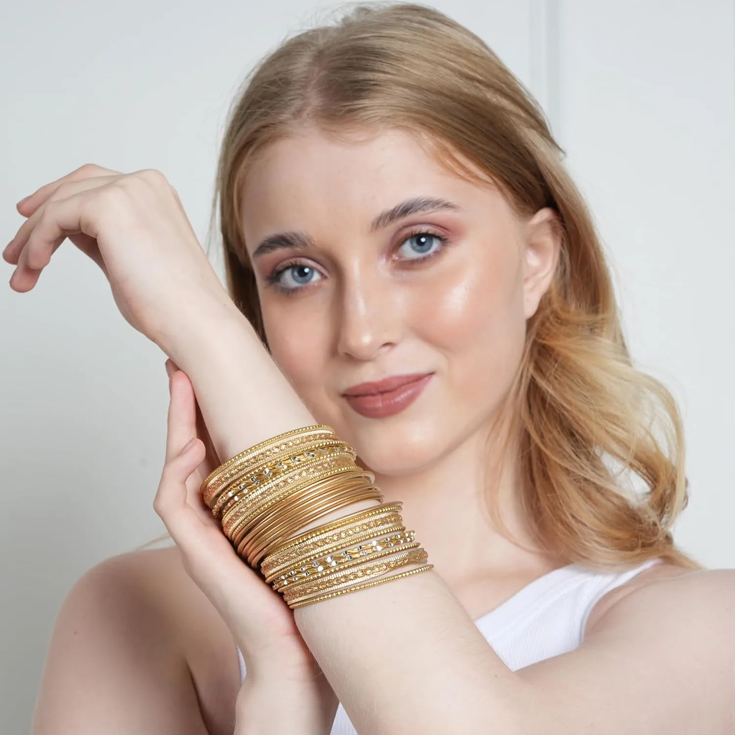 Touchstone Indian Metal Bangles for Women Gold Alloy Bracelets desi 2 Dozen Bangle Collection Bollywood Women's Jewelry Set Multi Stacking Wide Chunky Textured Golden Set of 24 in Gold or White Tone