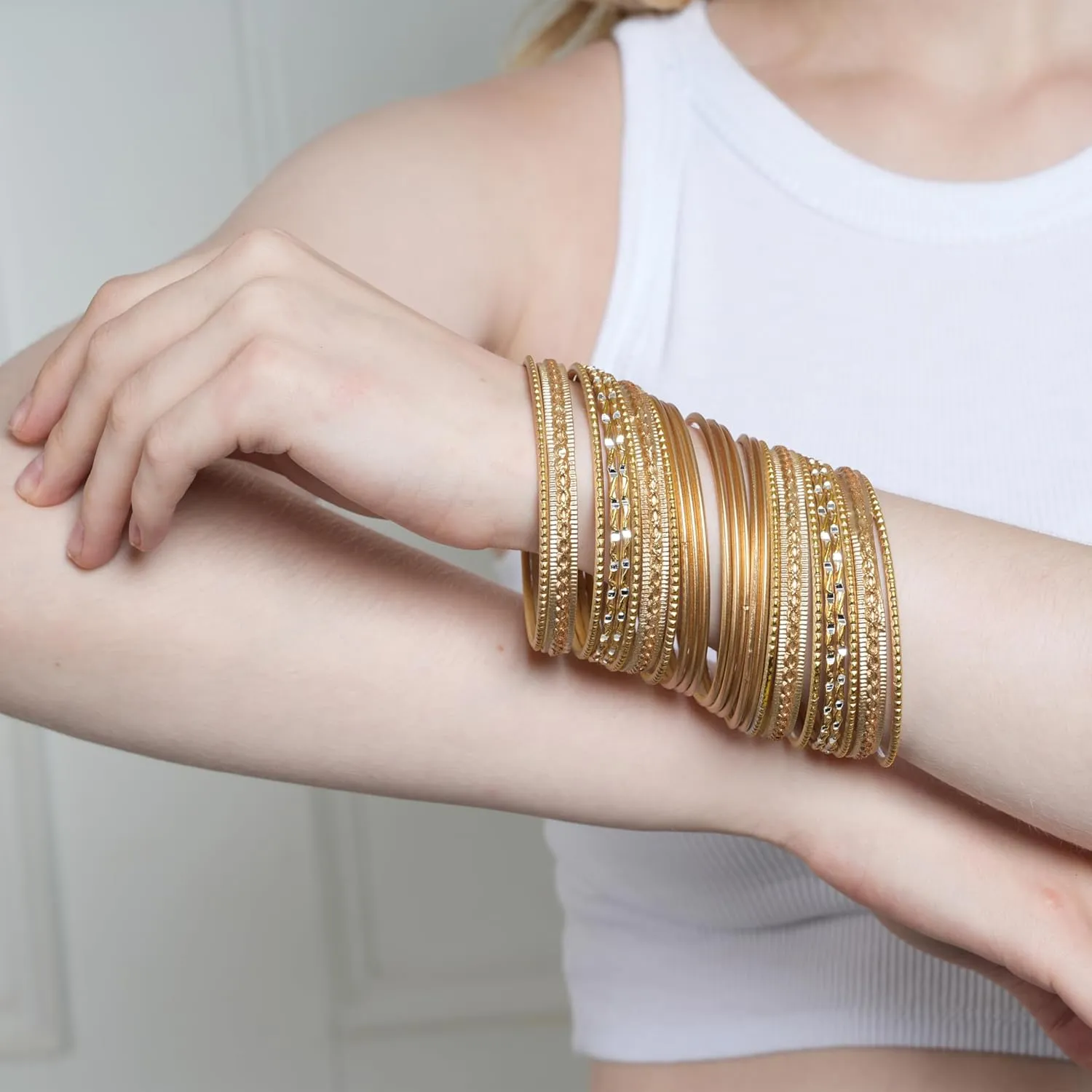 Touchstone Indian Metal Bangles for Women Gold Alloy Bracelets desi 2 Dozen Bangle Collection Bollywood Women's Jewelry Set Multi Stacking Wide Chunky Textured Golden Set of 24 in Gold or White Tone